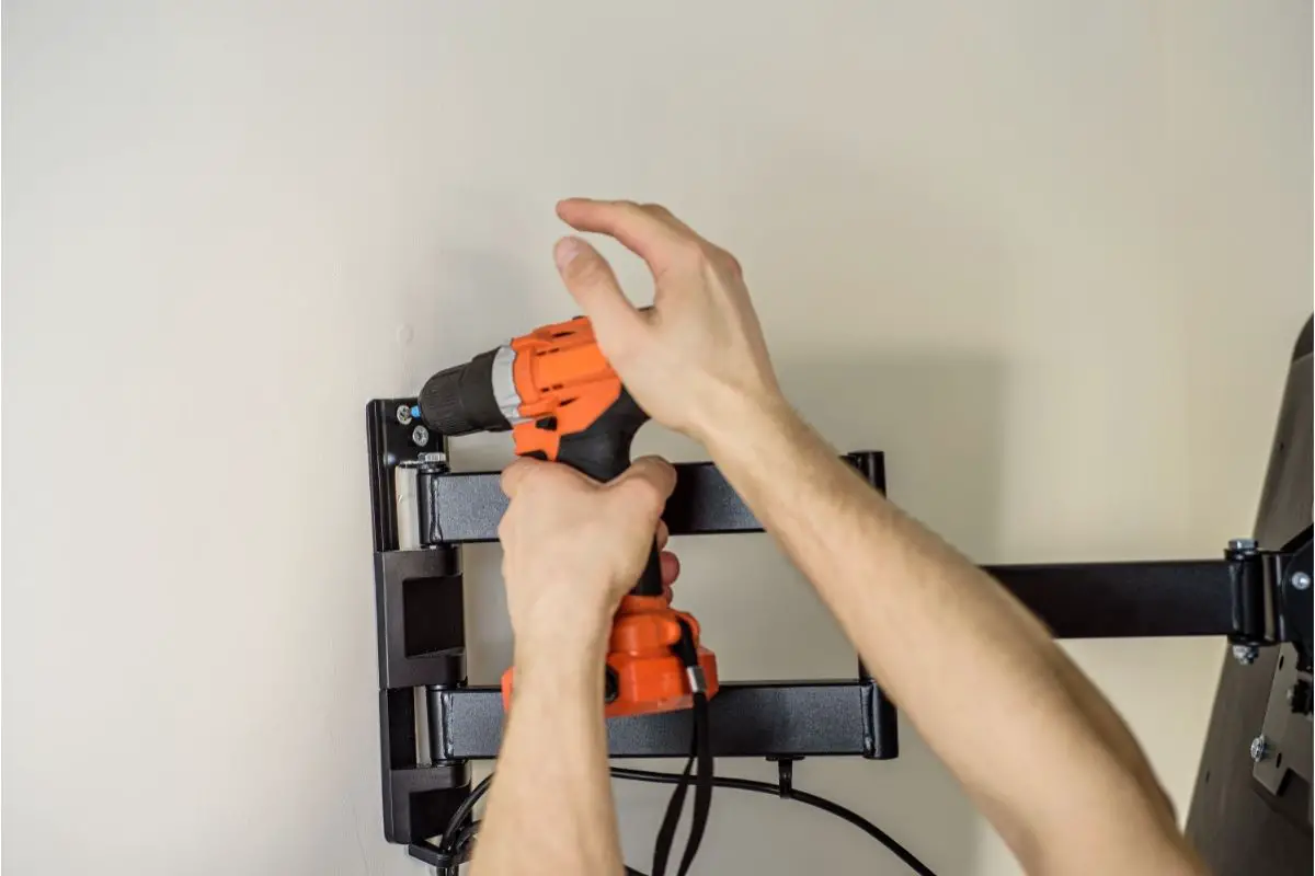 Mounting A TV On An Uneven Stone Wall With A Drill